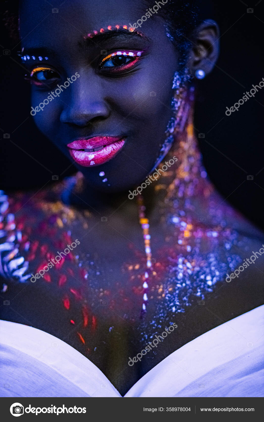 Fluorescent makeup on womans skin glowing under ultraviolet light Stock  Photo by ©romanchazov27 358978004